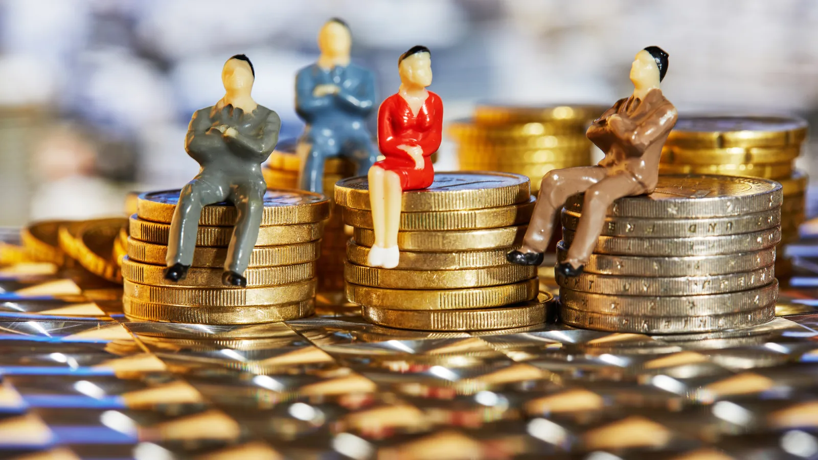 Miniature figures seated on stacks of coins of uneven heights.